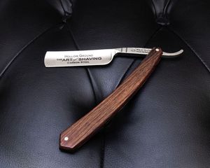 The Art of Shaving straight razor with wooden handle on leather cushion