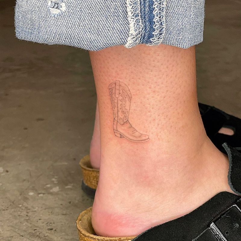 Shaded cowboy boot ankle tattoo