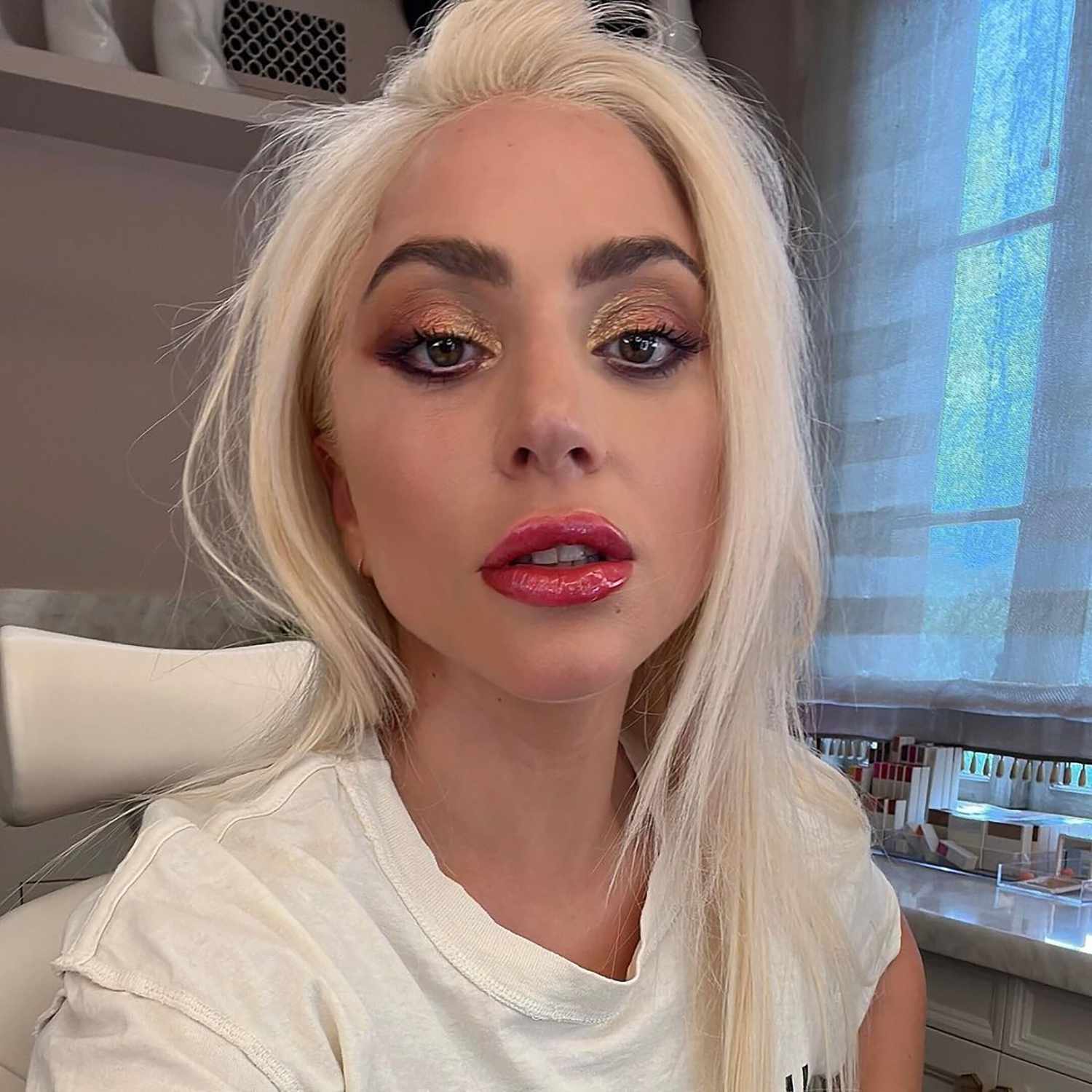 Lady Gaga in shiny eyeshadow with glossy lips