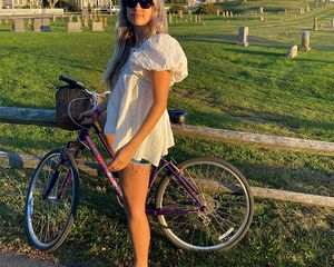 Aemilla Madden posing in front of a bike