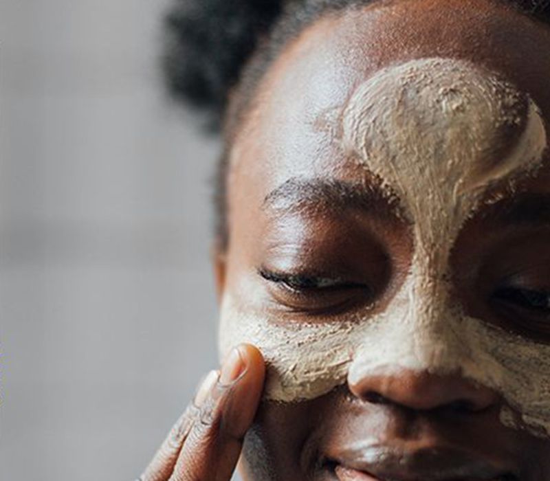 woman with clay mask