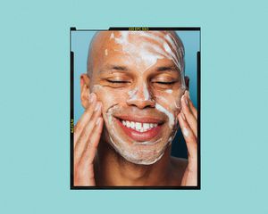 Man washing his face with foam cleanser