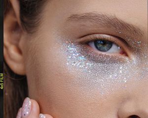 woman with glitter under eyes