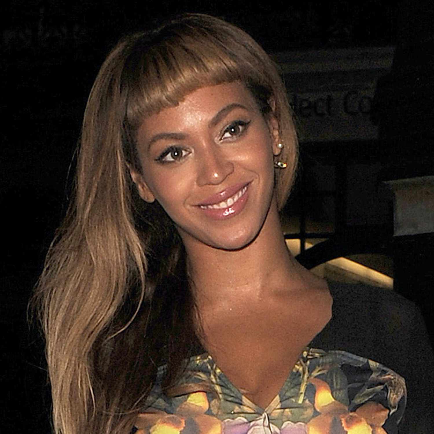 Beyonce wears long, tousled hair with baby bangs