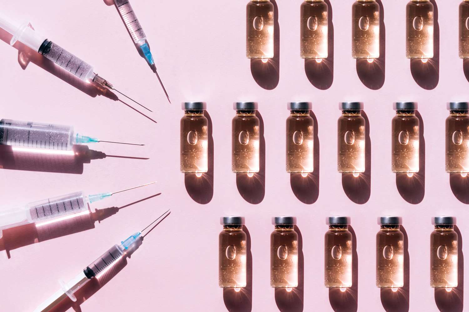 Bottles of neuromodulators surrounded by syringes