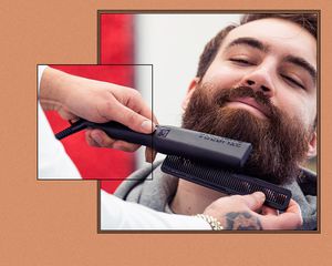 Barber using a heated beard tool on a client.