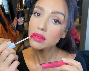 Jessica Alba applying lipstick