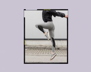 Woman jumping in fitness clothes.