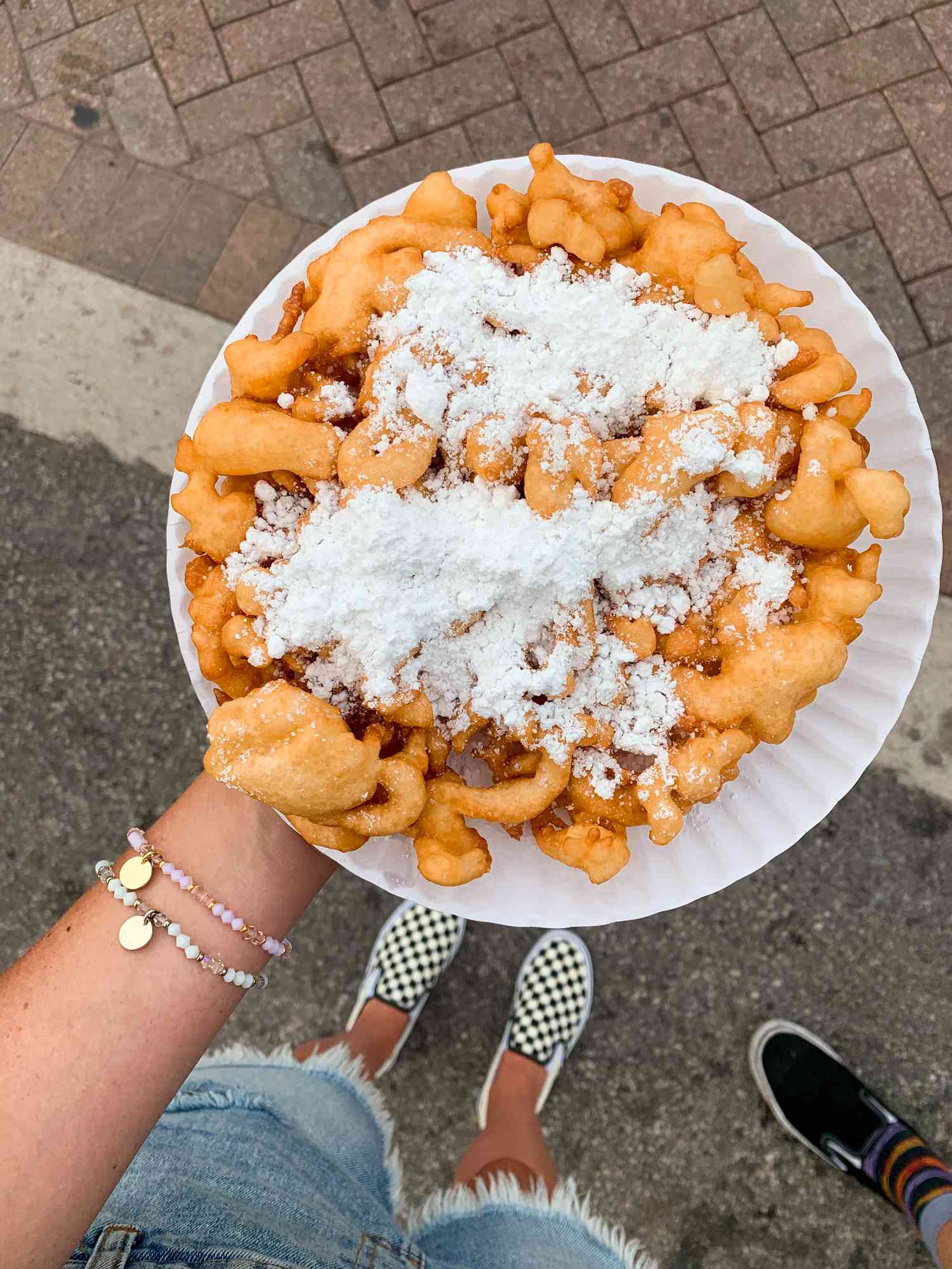 Funnel cake on a paper plate