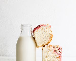 Milk bottle with cake propped on it