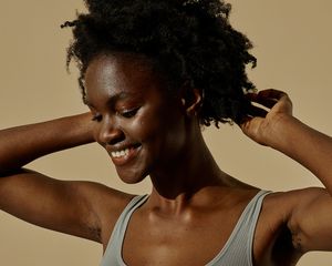 woman smiling with natural hair