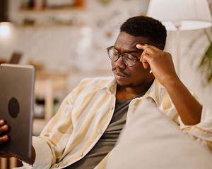 Young man having online mental health session online