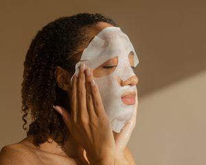 woman with sheet mask