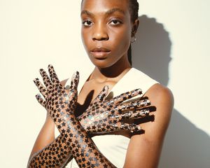 Model wearing Starface Black Star pimple patches as gloves