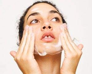 Woman washing face