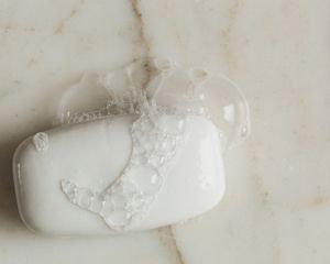 sudsy bar soap on marble surface