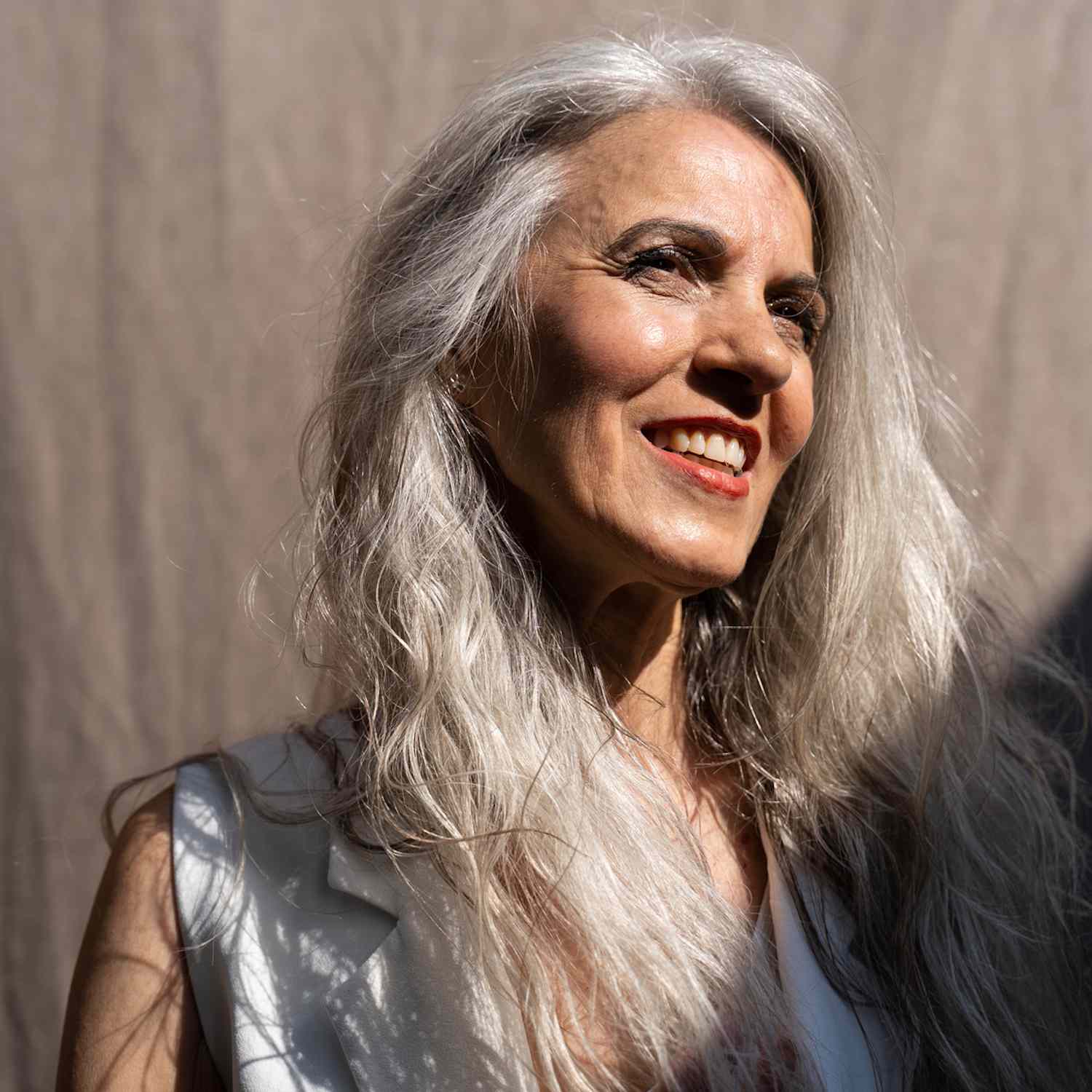 woman with silver hair smiling 