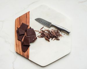 dark chocolate on board with knife
