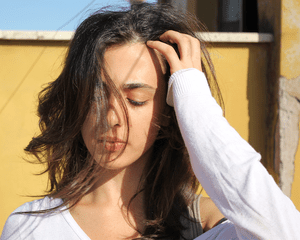 Woman touching her hair