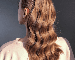 back of woman's head with long red hair