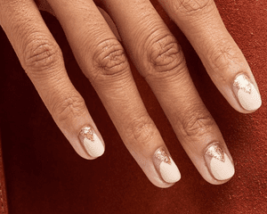 woman with rose gold and gold manicure